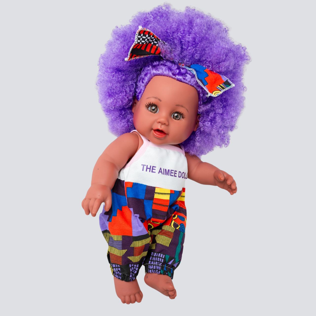 The Aimee Doll in Purple Afro Hair and Branded Jumpsuit - Light Brown